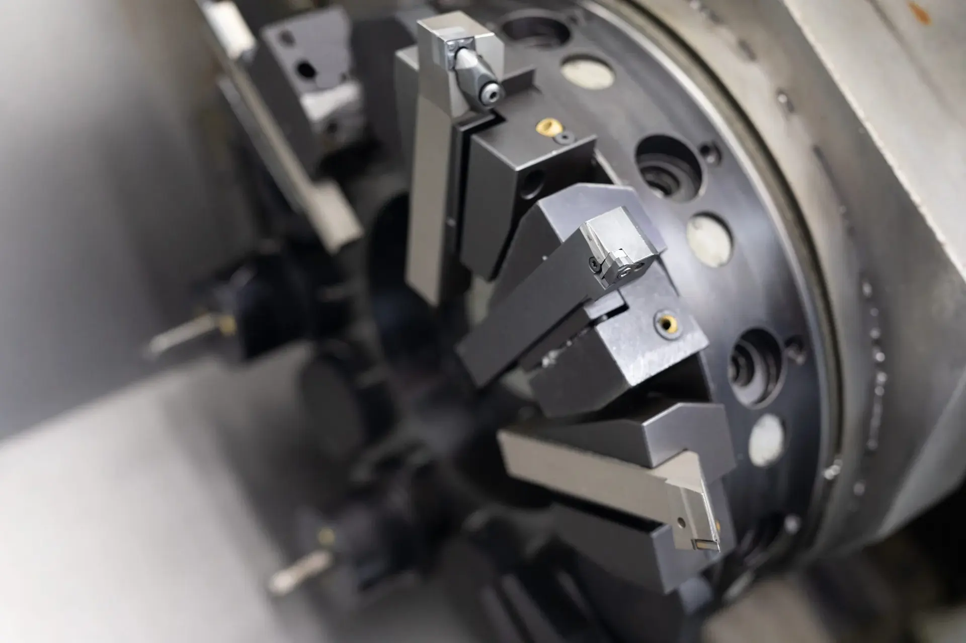 Close-up of machine mechanisms processing a metal product